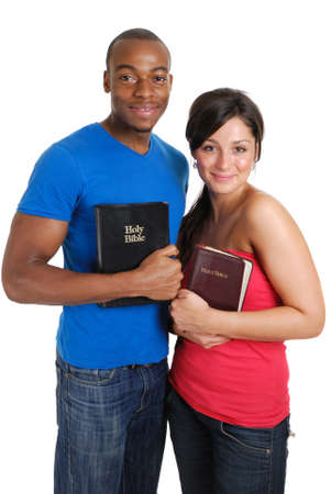 This is an image of a student couple holding bibles.の写真素材