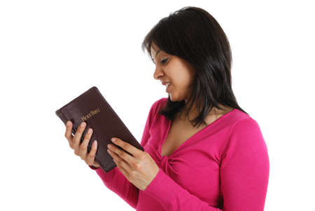 This is an image of a woman reading the bible.の写真素材