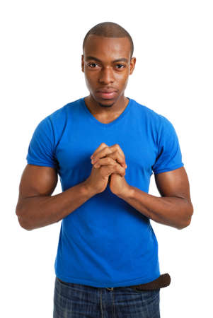 This is an image of male student doing a prayer gesture.の写真素材