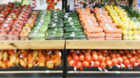 Blurry - Blur image of fresh vegetables and fruits on shelf in supermarket convenience store for background.の写真素材