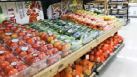 Blurry - Blur image of fresh vegetables and fruits on shelf in supermarket convenience store for background.の写真素材