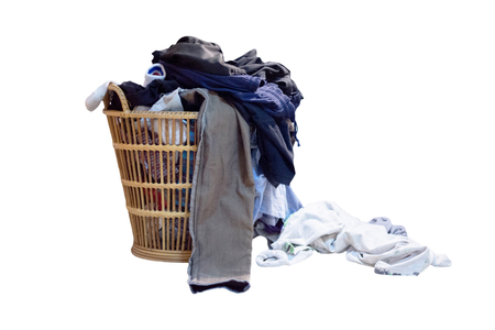 Overflowing laundry basket on white backgroundの写真素材