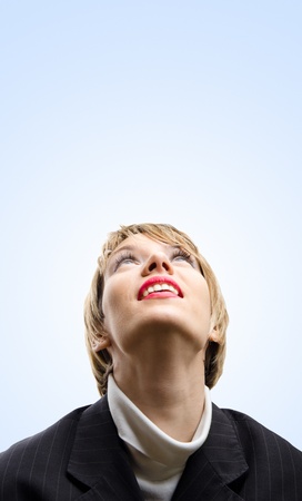 Girl looking up to the skyの写真素材