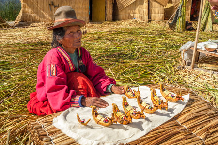 Woman Selling Souvenirs from Los Uros Islandのeditorial素材