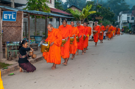 Tak Bat - Morning Alms-Giving in Luang Prabang - Laosのeditorial素材