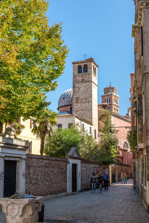 VENICE,ITALY - SEPTEMBER 23,2014 - In the streets of Venice. The Venice finds several streets for pedestrians.のeditorial素材