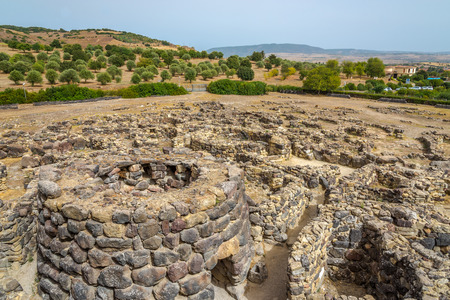 BARUMINI,ITALY - SEPTEMBER 20,2014 - View at the ruins from Su Nuraxi nuraghe near Barumini in Sardinia.Su Nuraxi is a settlement consisting by a Nuraghe, dating from the seventeenth century BC.の写真素材