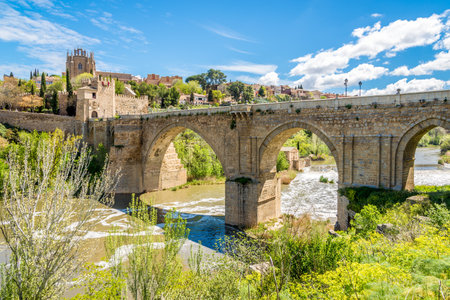 TOLEDO,SPAIN - APRIL 23,2016 - Bridge San Martin over river Tajo in Toledo. Toledo is a municipality located in central Spain.のeditorial素材