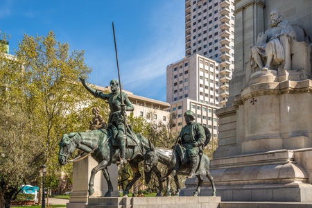 MADRID,SPAIN - APRIL 25,2016 - Cervantes Memorial with statues Don Quixote and Sancho Panza. Square of Spain is a large square, and popular tourist destination, located in central Madrid.のeditorial素材