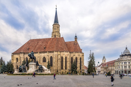 CLUJ-NAPOCA, ROMANIA - MARCH 20,2017 - Church of St.Michael with statue of Matei Corvin in Cluj - Napoca. Cluj-Napoca is located in the central part of Transylvania.のeditorial素材