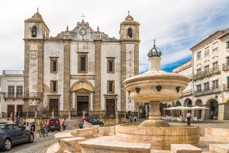 EVORA,PORTUGAL - MAY 16,2017 - Chafariz fountain with Saint Anton church at the square Giraldo in...