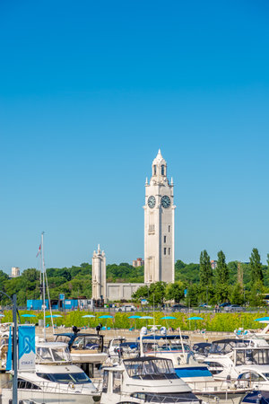 MONTREAL, CANADA - JUNE 22,2018 - View at the Clock tower at bank of Saint Lawrence river in Montreal. Some of the citys earliest still-standing buildings date back to the late 17th and early 18th centuries.のeditorial素材