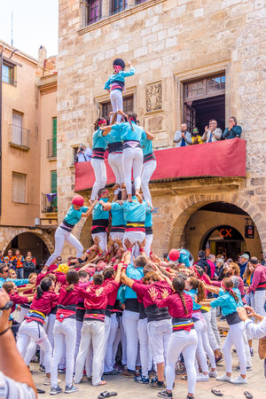 MONTBLANC,SPAIN - MAY 19,2019 - Building human towers in the streets of Montblanc. The area around Montblanc has been inhabited for thousands of years.のeditorial素材