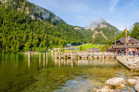 KONIGSSEE, GERMANY - SEPTEMBER 10,2019 - View at the Port of Konigssee lake near Berchtesgaden. The Konigssee is a natural lake in the extreme southeast Berchtesgadener Land in Germany.のeditorial素材