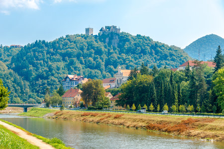 View at the Savinja river with Old Castle on a hill in the background in Celje, Sloveniaのeditorial素材