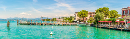 SIRMIONE, ITALY - JUNE 28,2021 - Panoramic view at the Lake Garda in Sirmione. Sirmione lies on the shores of Lake Gardaのeditorial素材