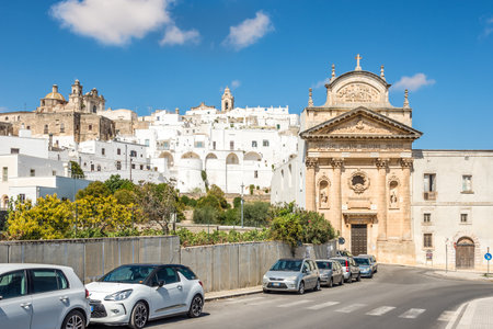 OSTUNI, ITALY - SEPTEMBER 3,2021 - Carmelitas Church in the streets of Ostuni. Ostuni is a city and comune, located about 8 km from the coast, in the region of Apulia, Italy.のeditorial素材