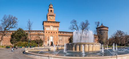 MILAN,ITALY - MARCH 22,2022 - Panoramic view at the fountain with Sforzesco Palace Tower in Milan. Milan is a city in northern Italy, capital of Lombardy.のeditorial素材