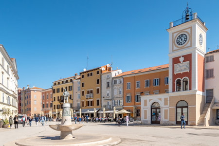 ROVINJ,CROATIA - APRIL 25,2022 - Clock tower and Fountain at the Market place of Rovinj. Rovinj. Rovinj is a city in Croatia situated on the north Adriatic Sea.のeditorial素材