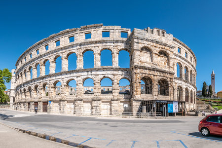 PULA,CROATIA - APRIL 25,2022 - View at the Ruins of Arena (Roman amphiteatre)in the streets of Pula. Pula is the largest city in Istria County, Croatia.のeditorial素材