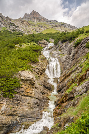 View at the Braulio Waterfall on the road to Stelvio Pass in Italyの写真素材