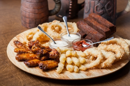 a large plate with a wide selection of snacks for beerの写真素材