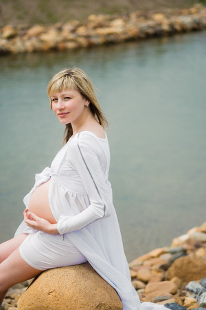 Beautiful pregnant woman outdoorの写真素材