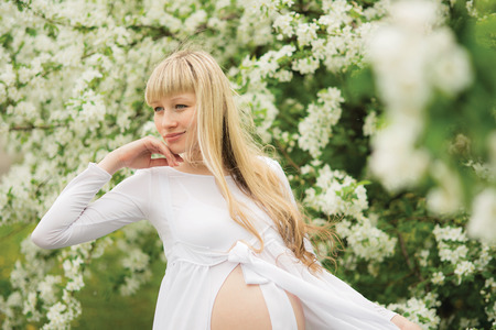 Beautiful pregnant woman outdoorの写真素材