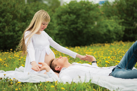 Beautiful pregnant woman outdoorの写真素材
