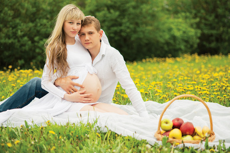 Beautiful pregnant woman outdoorの写真素材