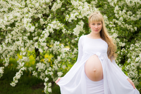 Beautiful pregnant woman outdoorの写真素材
