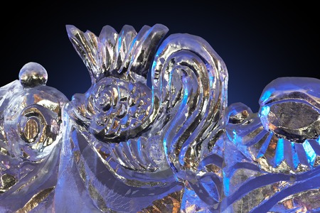 Beautiful winter ice sculpture of a frozen goldfish.の写真素材