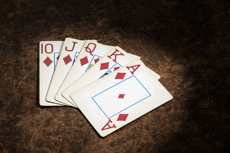 old playing cards collected from a combination of poker royal flushの写真素材