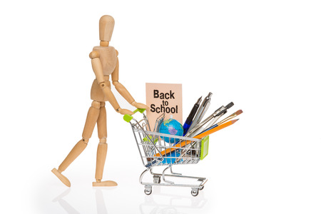 high resolution photo of trolley with school equipment on white background and a card with the words "back to school"の写真素材