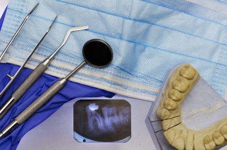 Dental instruments with gloves, mask, model, x ray .の写真素材
