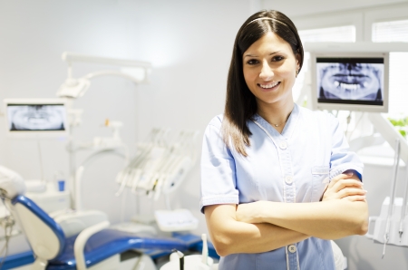 Portrait of a beautiful young woman doctor, dentistの写真素材