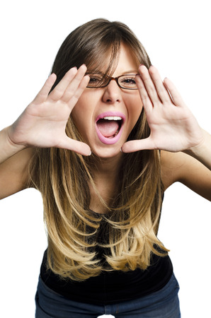 portrait of pretty young beautiful woman loud screaming or calling out to someone, isolated over white の写真素材
