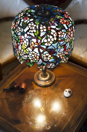 Beautiful hand made lamp on wooden tableの写真素材