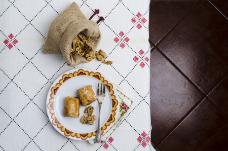 Turkish baklava with honey and nuts on tableの写真素材