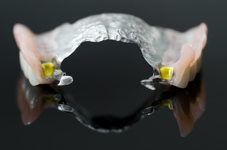 New dental prosthesis on black background