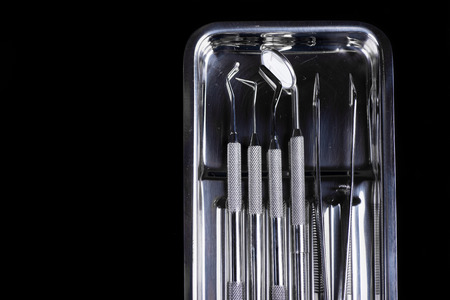 Dental instruments on black backgroundの写真素材