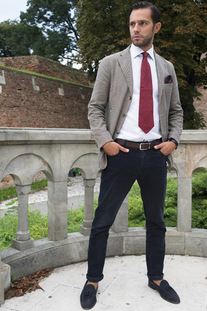 Handsome young  business man in the park after workの写真素材
