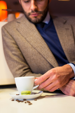 Business man in coffee shop, drinking espressoの写真素材