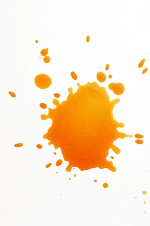 yellow spatter stain on whiteの写真素材