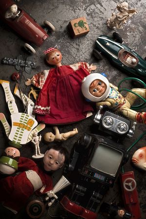 old, broken toys on the floorの写真素材