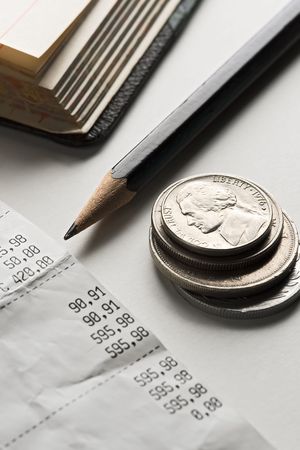 bills, coins and pencil