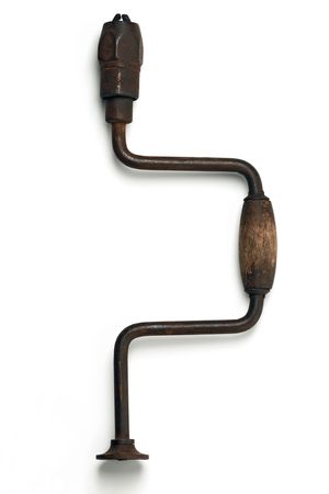 old rusty hand drill on whiteの写真素材