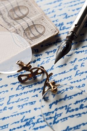 rimless glasses on an old letterの写真素材