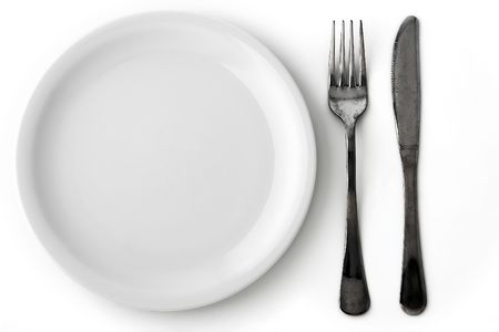 knife, fork and a white plate on white