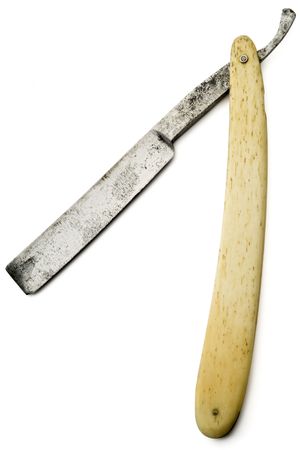 an old rusty razor on white